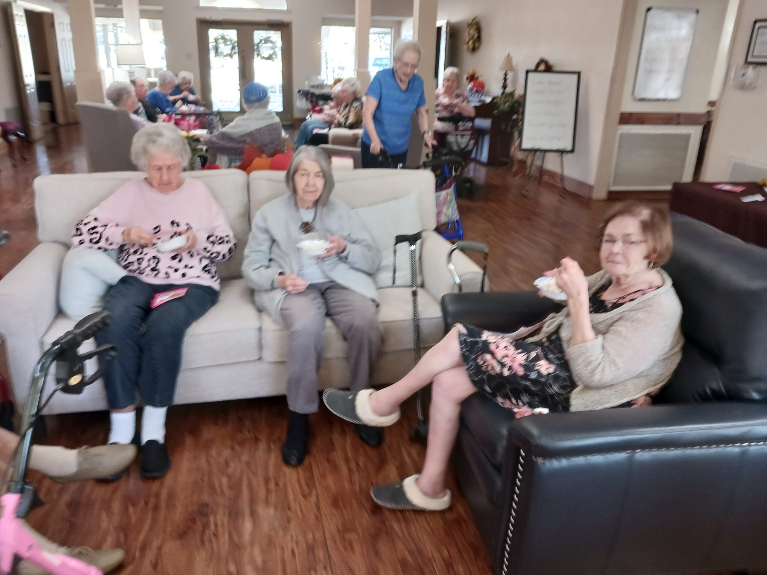 Residents enjoying ice cream in a common area.