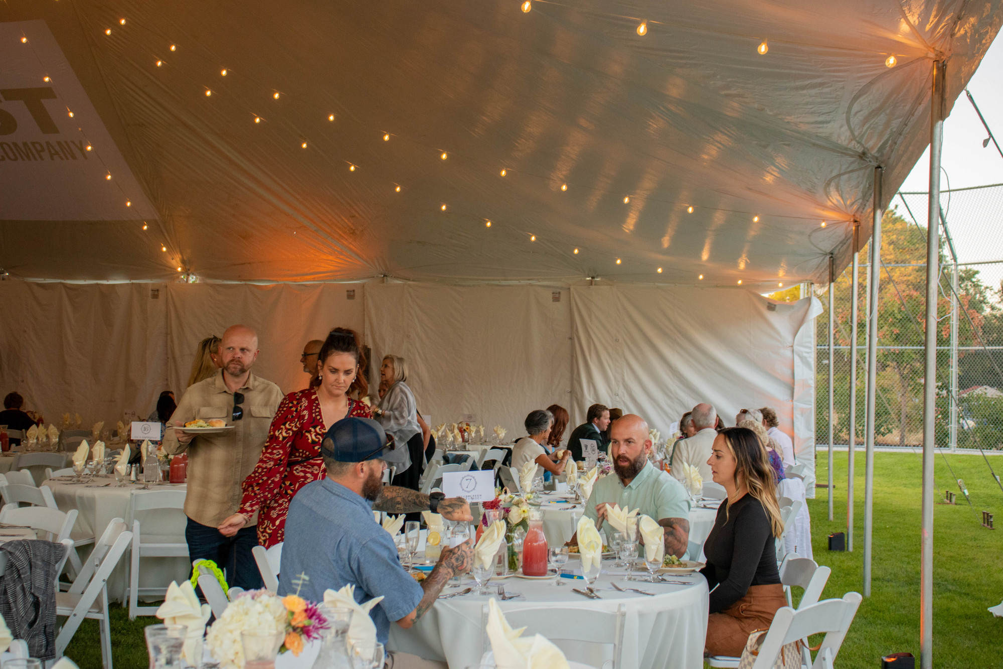 Residents enjoying a festive outdoor dining event.