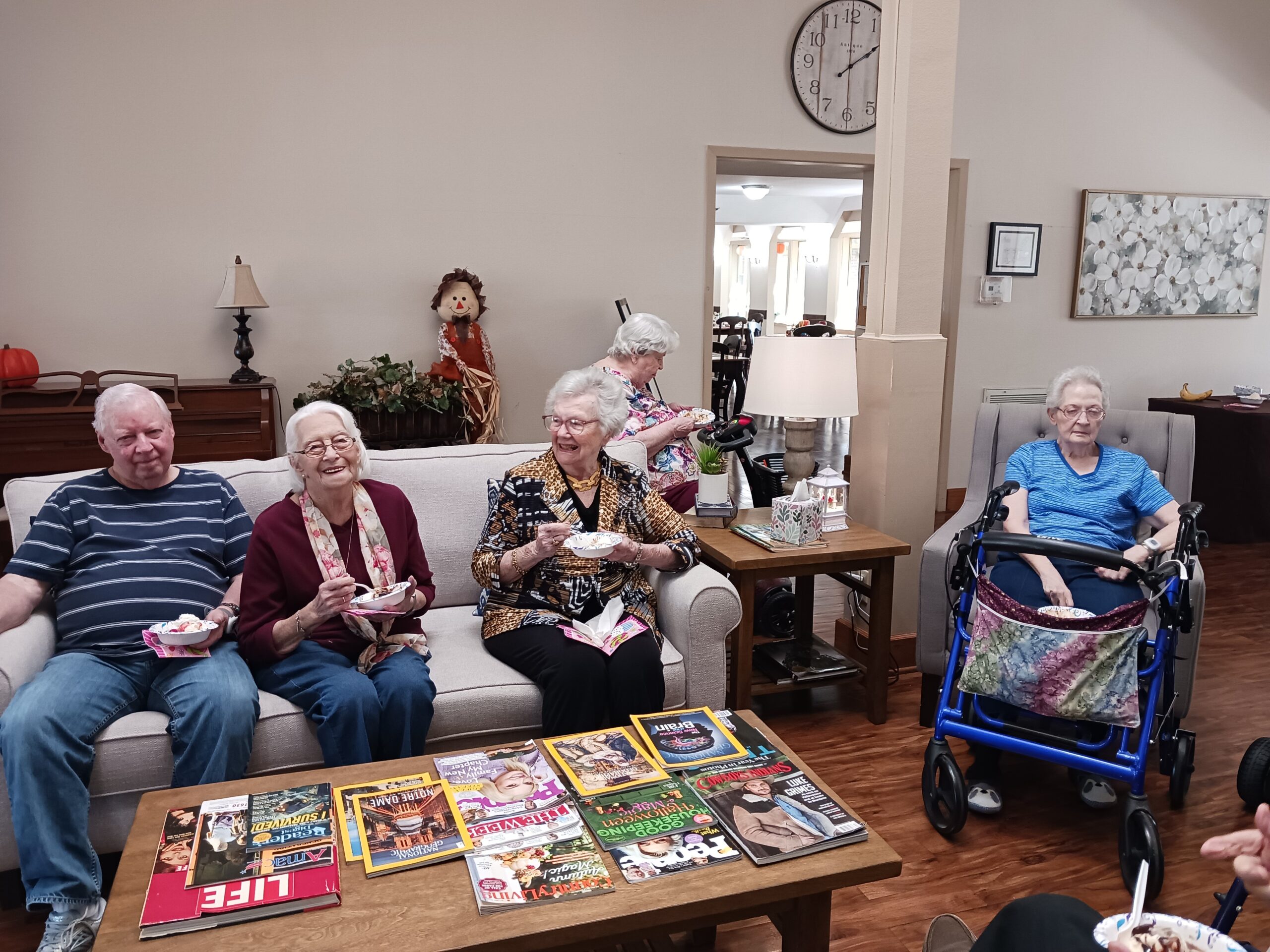 Residents enjoying snacks in a common area.