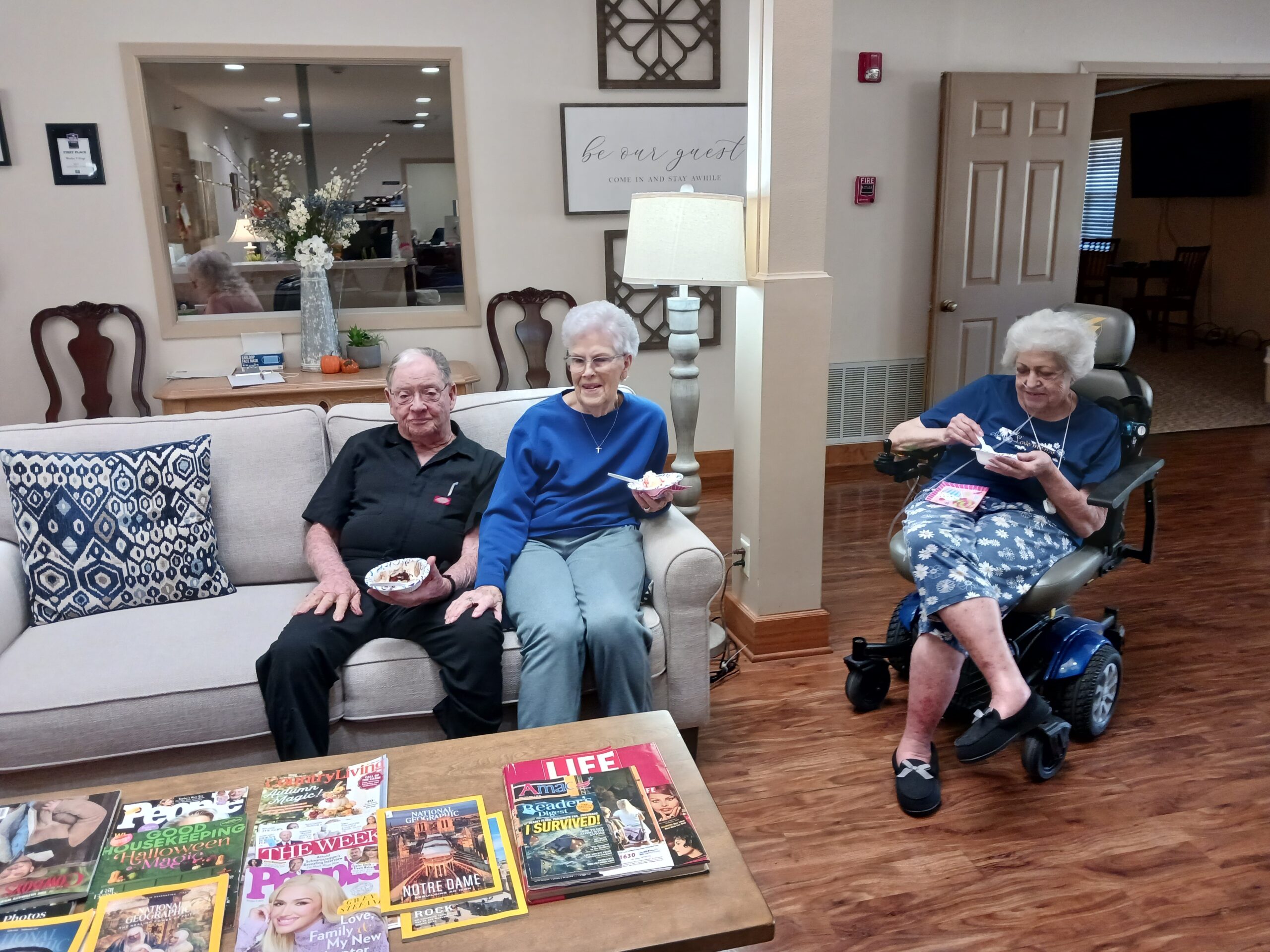 Residents enjoying snacks in a common area.