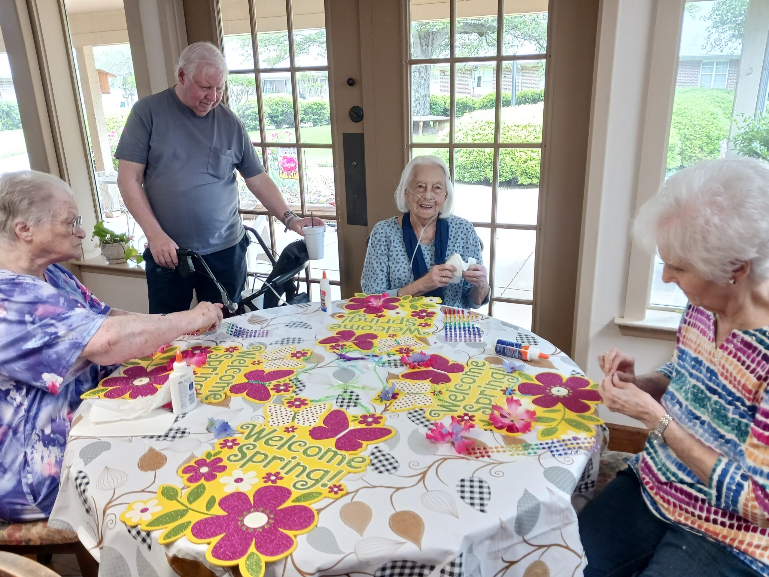 Residents engaged in spring-themed craft activity.