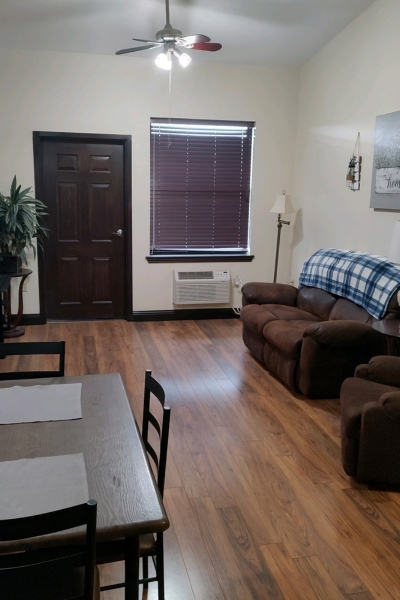 Cozy common area with seating and a table.