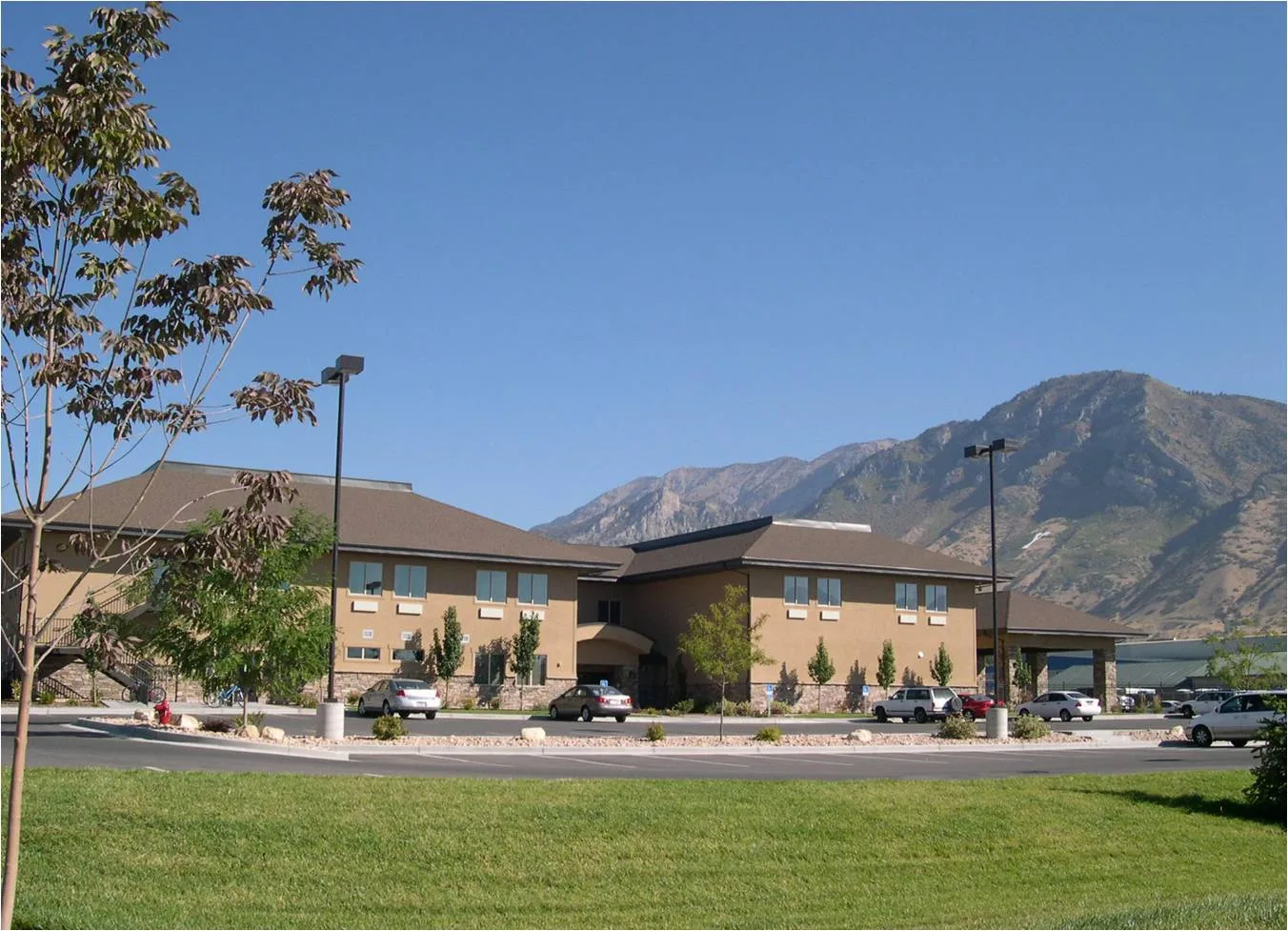 Exterior view of the facility with mountains in background.