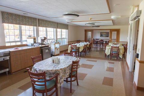 Bright dining area with tables and chairs