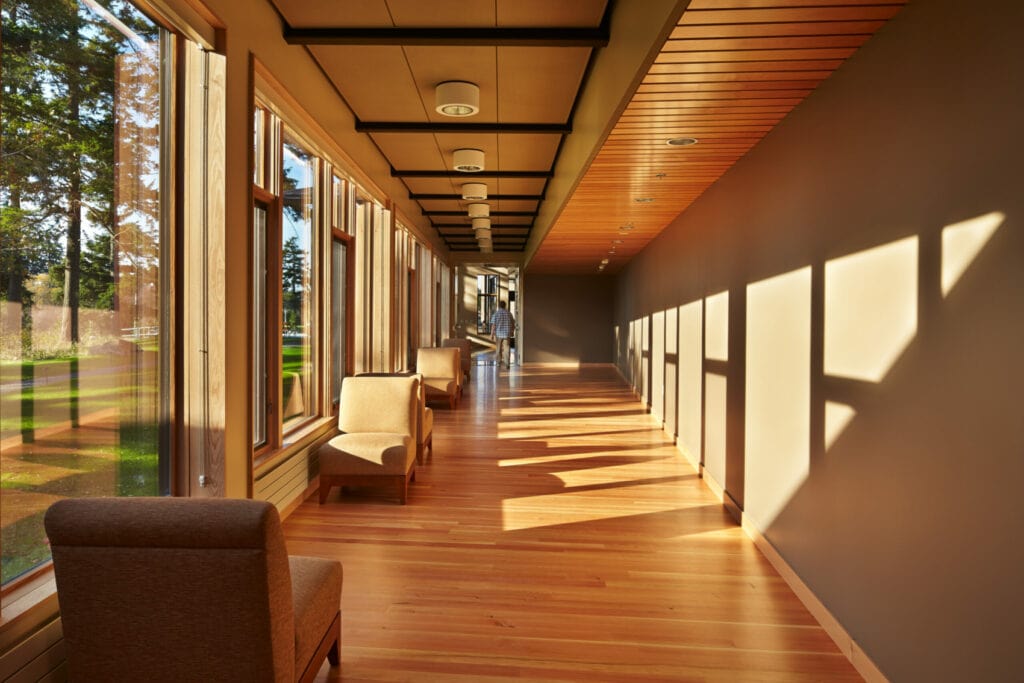 Bright hallway with chairs and large windows
