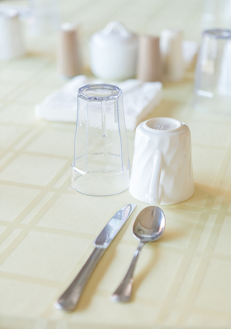 Table setting with utensils and glassware.