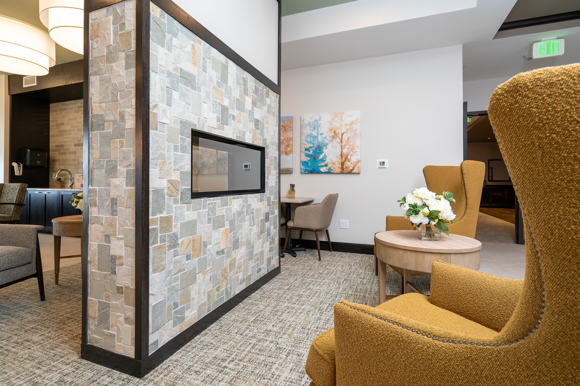 Cozy common area with seating and natural decor.