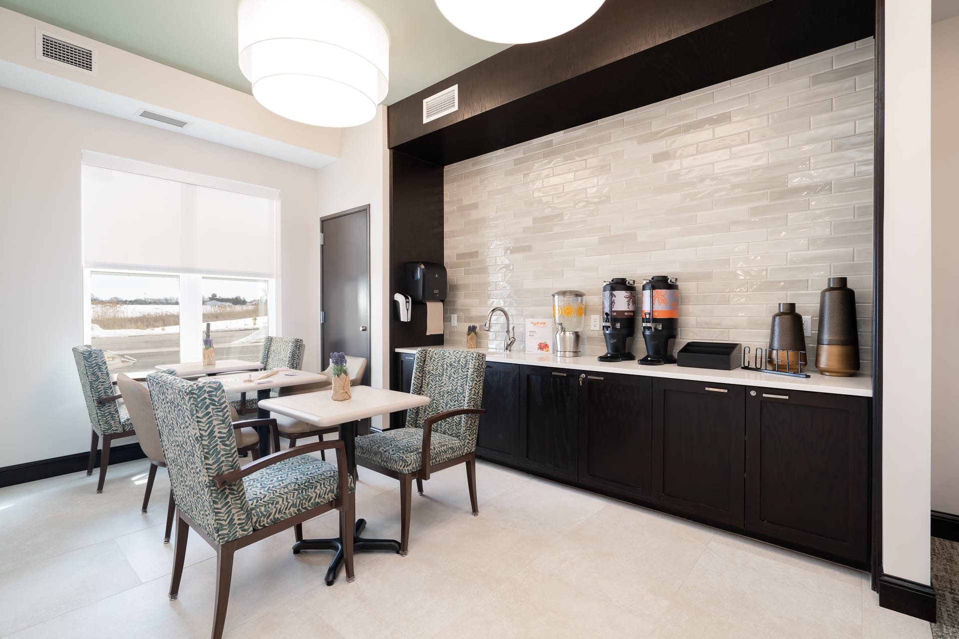 Bright common area with seating and refreshments