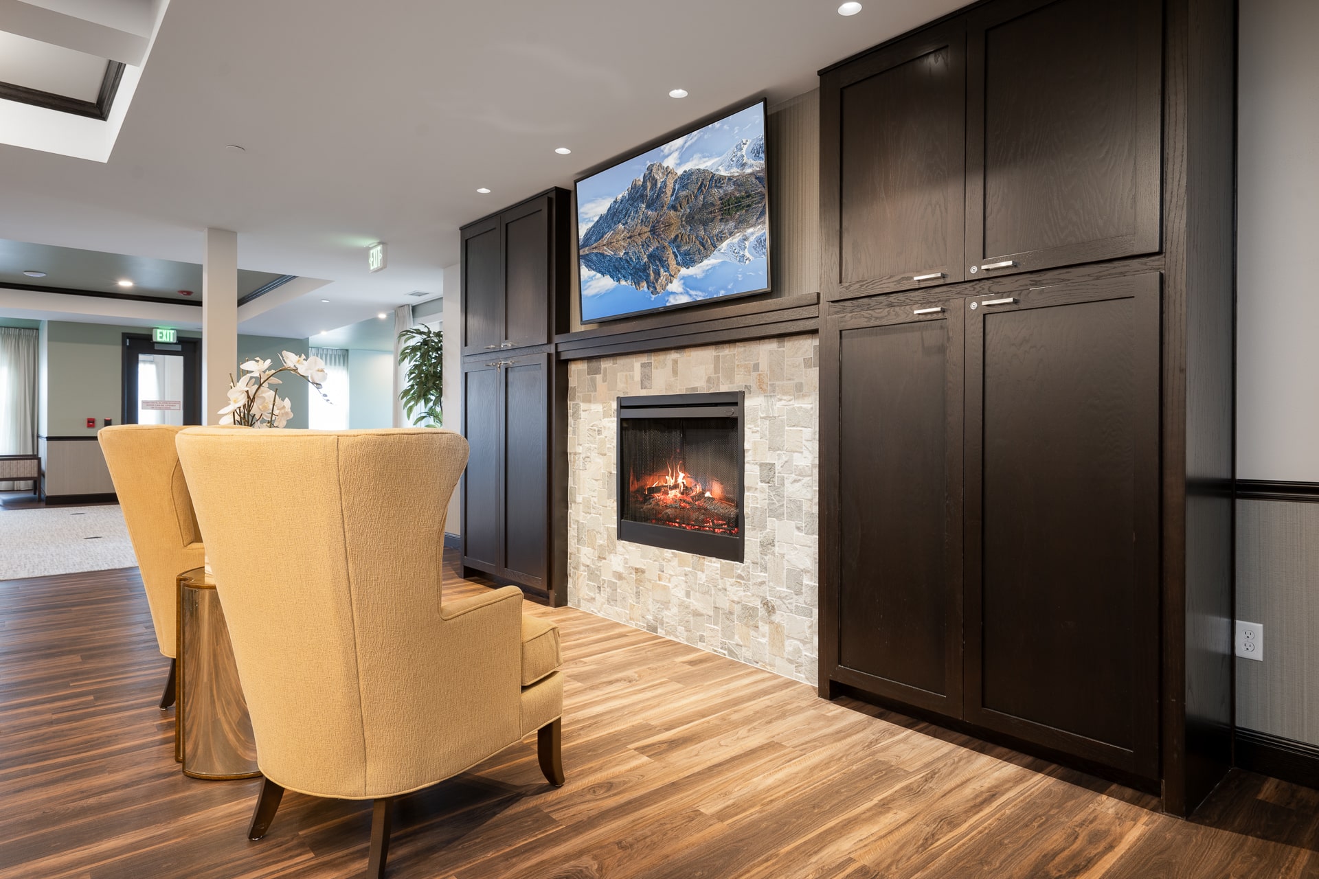 Common area with comfortable chairs and a fireplace