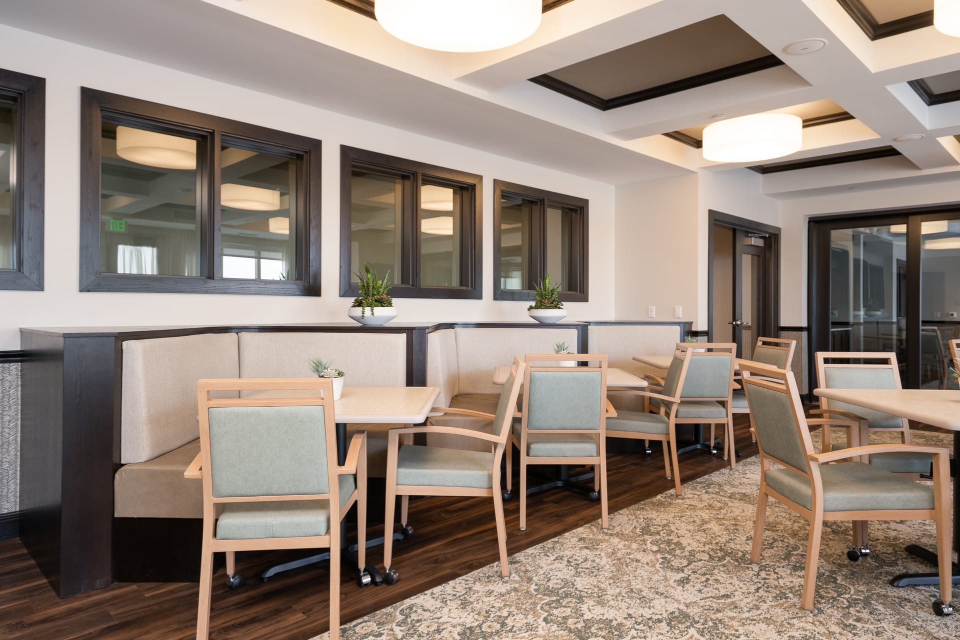 Cozy common area with seating and windows.