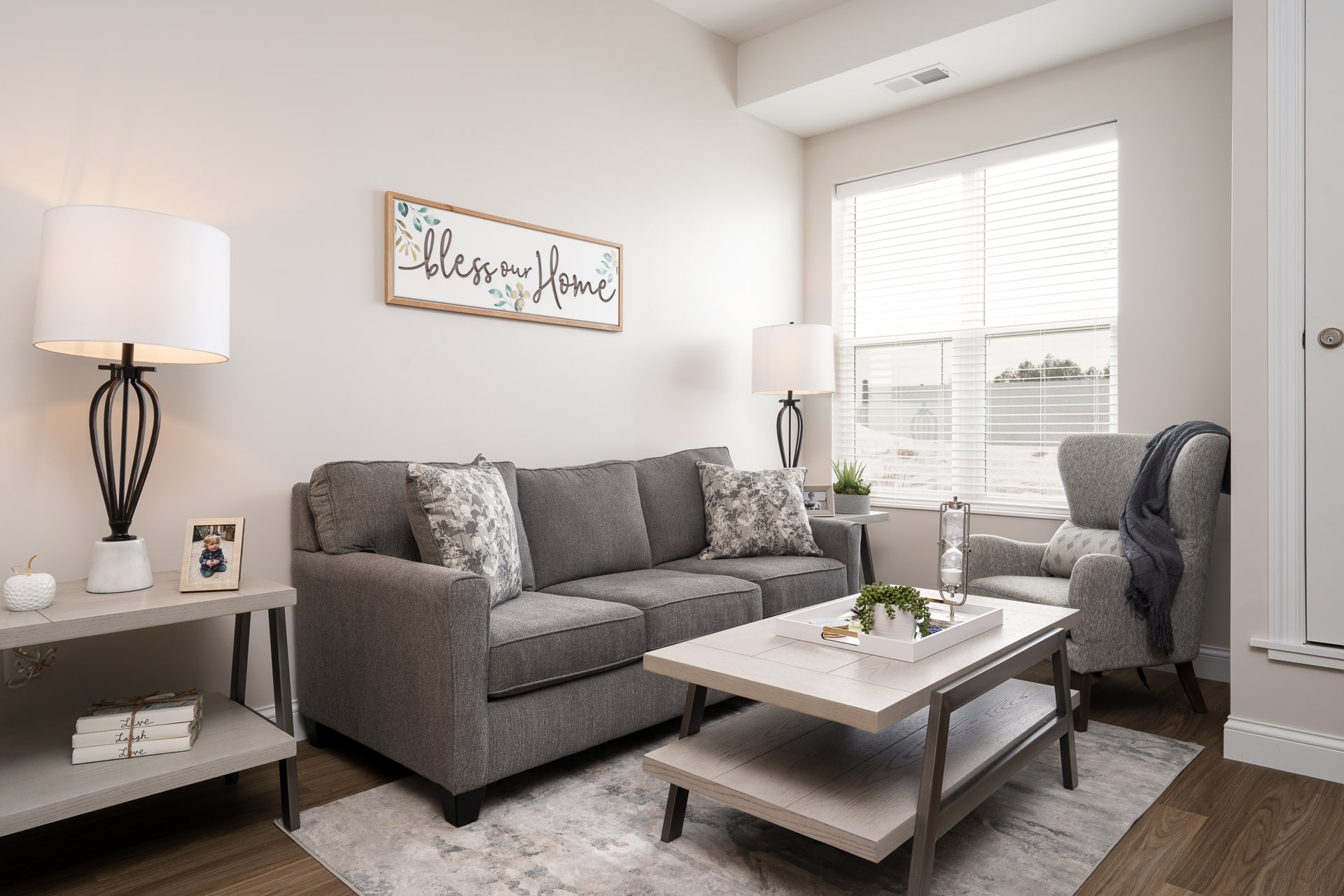 Cozy living room with soft furnishings and decor.