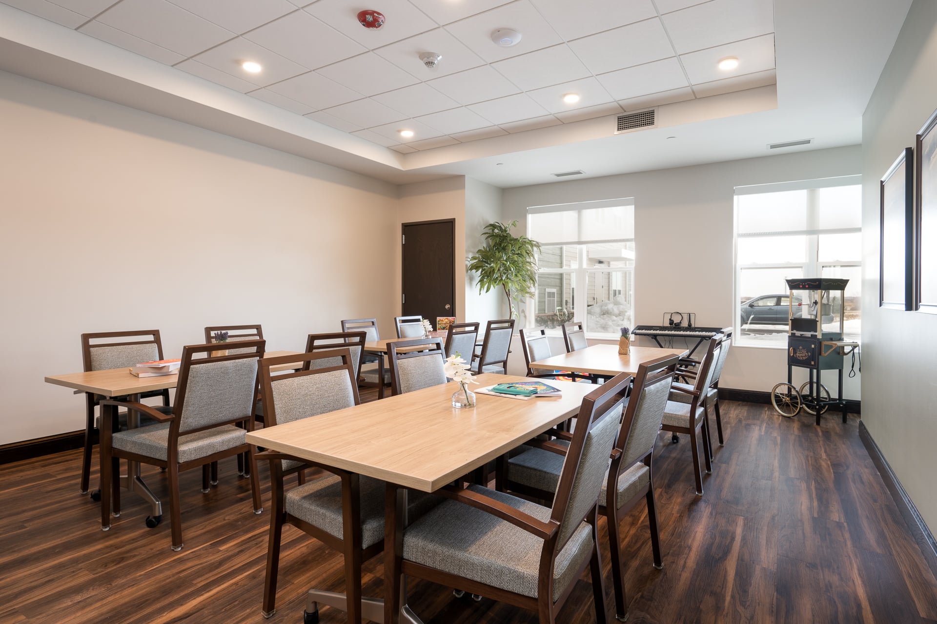 Bright dining area with wooden tables and chairs