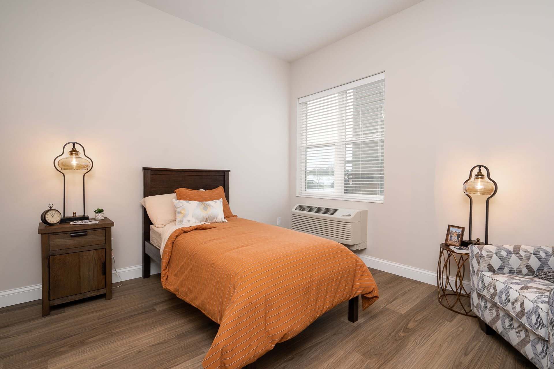 Private resident room with bed and decor