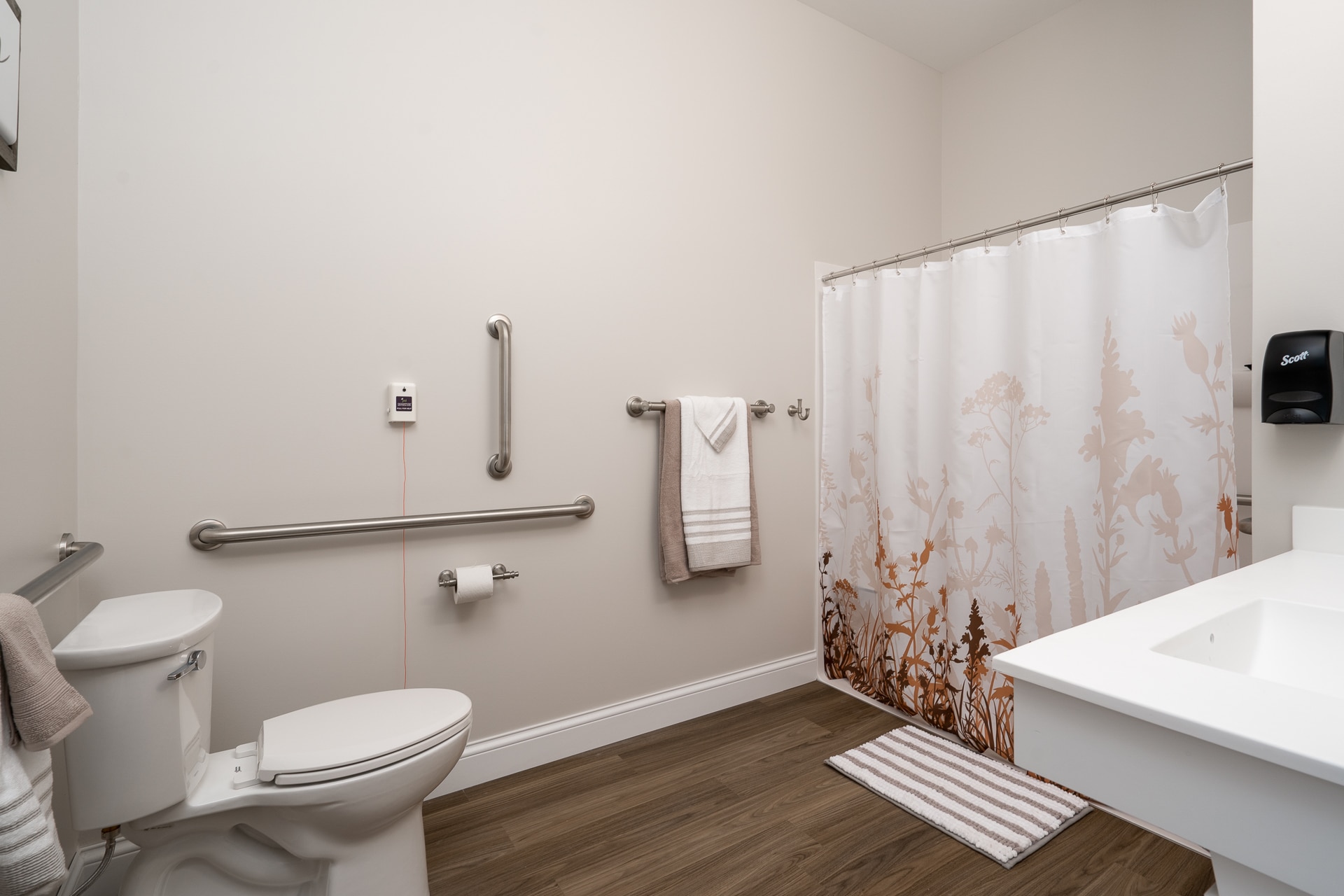 Clean, accessible bathroom with supportive features