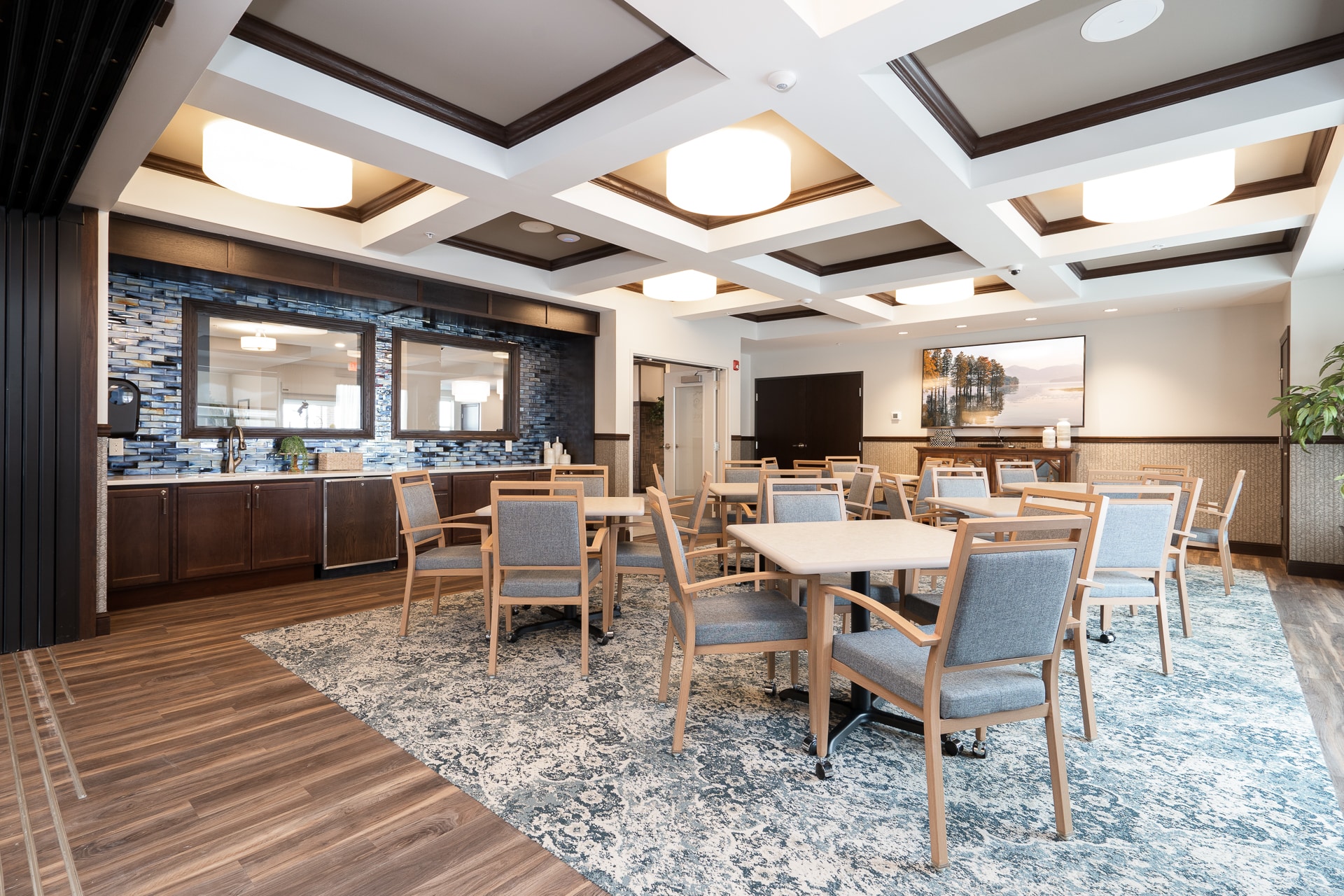 Bright common area with seating and decor.