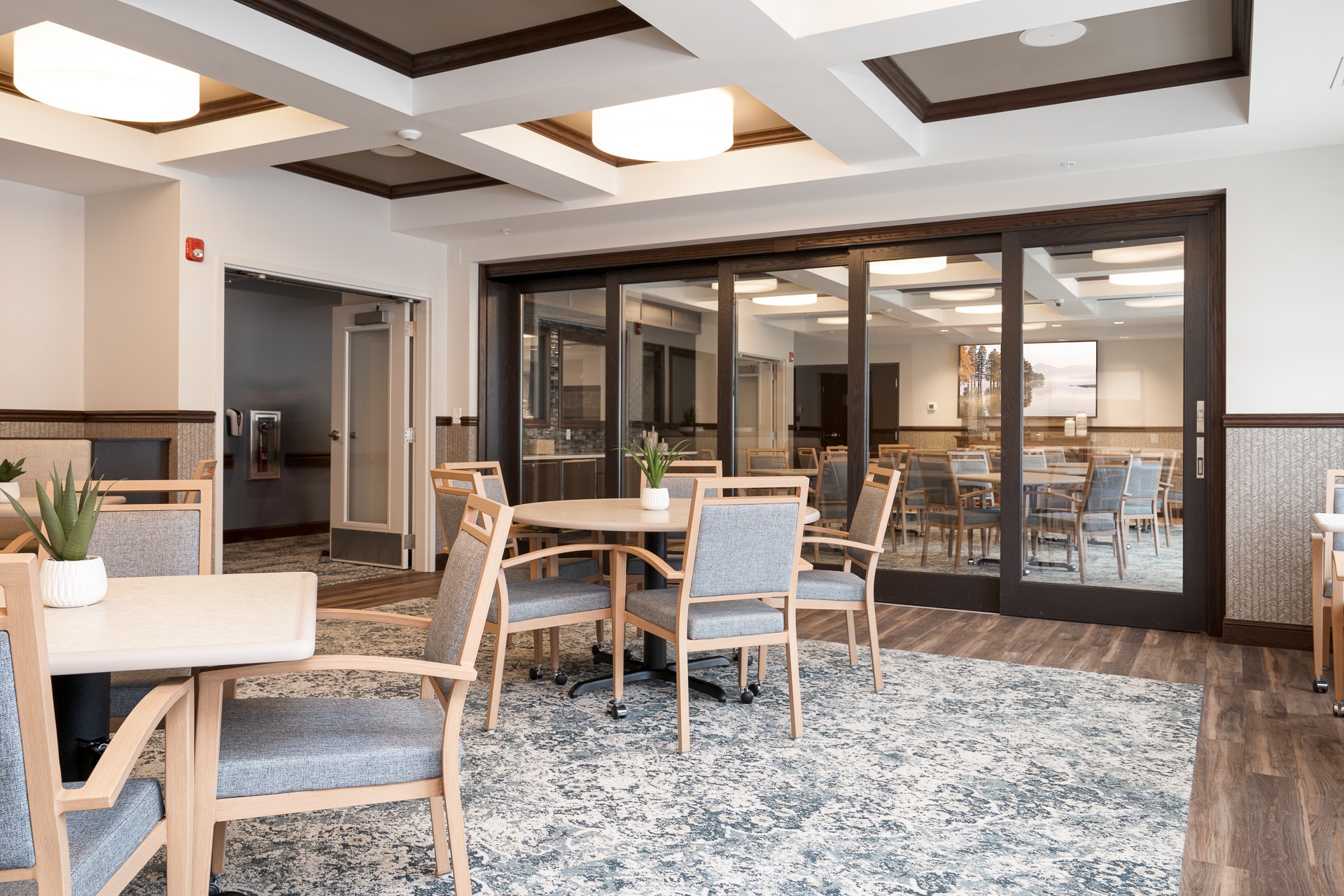 Bright interior common area with tables and chairs