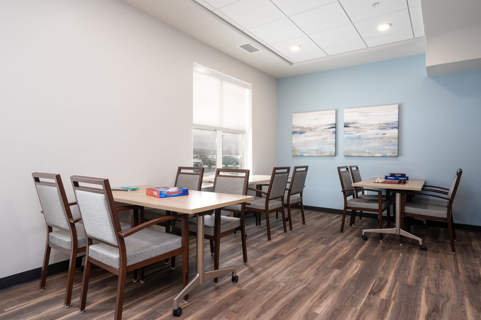 Common area with tables and chairs for activities