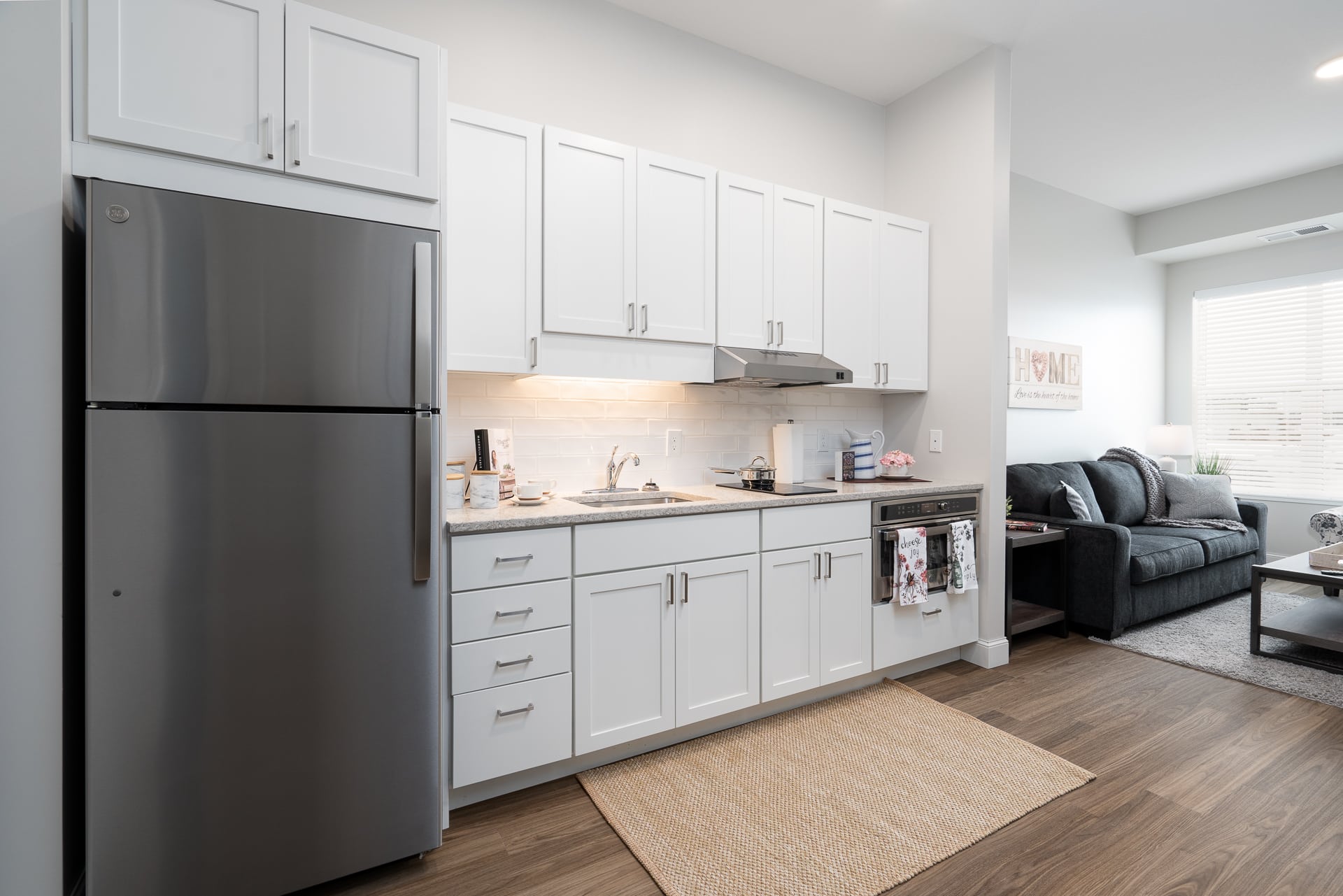 Modern kitchen area in a senior living apartment.