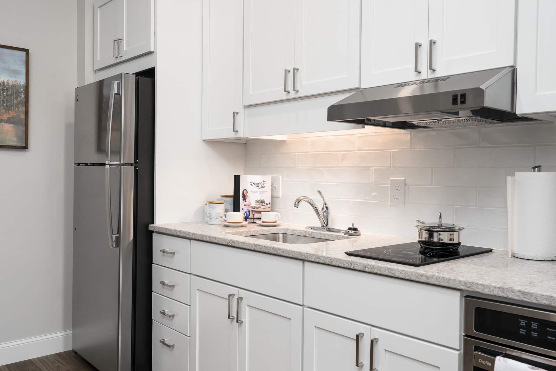 Bright kitchen area with modern appliances