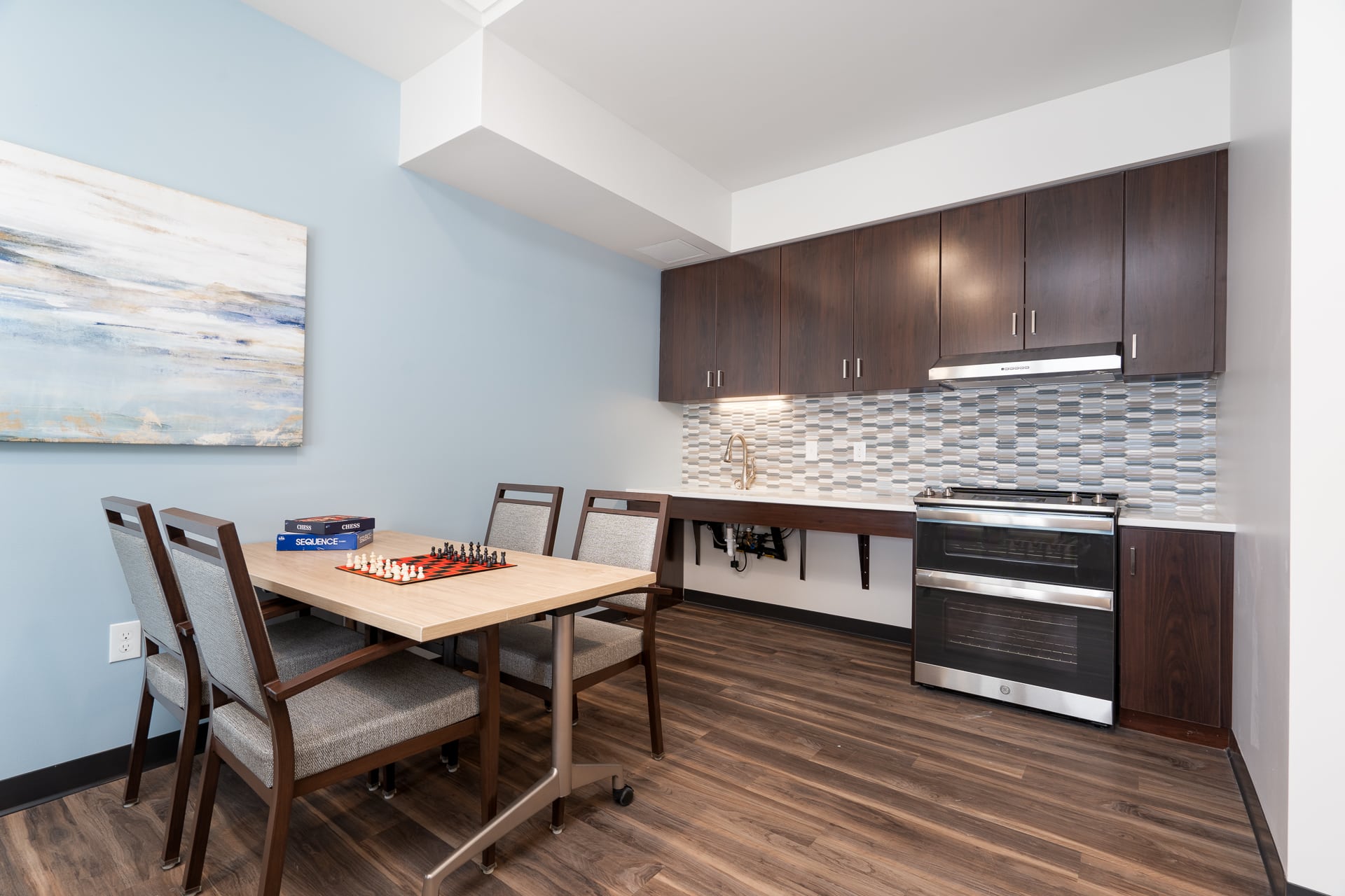Cozy interior of a resident's apartment with a chess table.