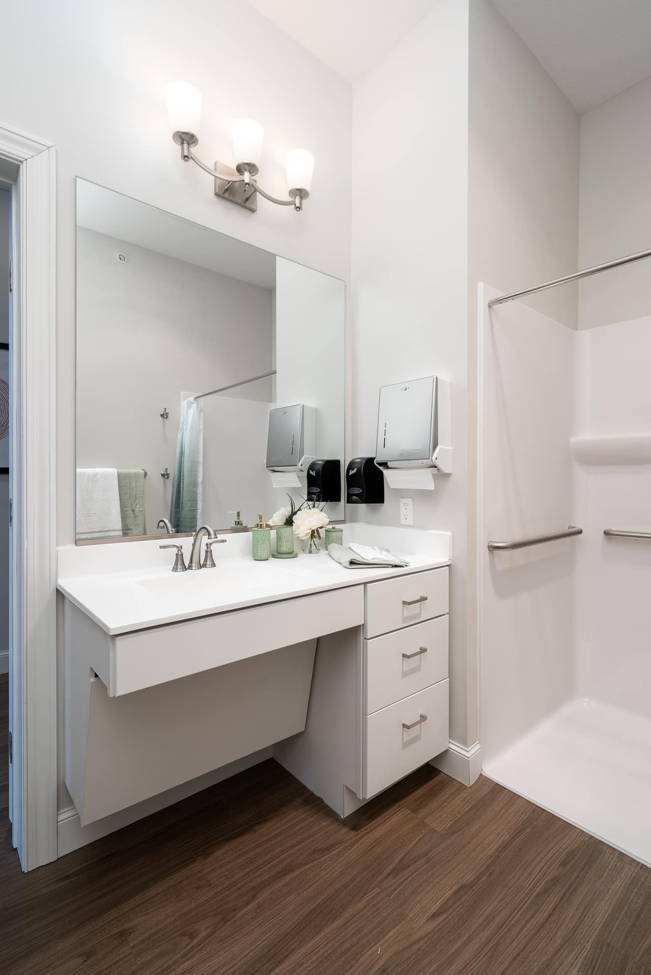 Modern bathroom with sink and shower.