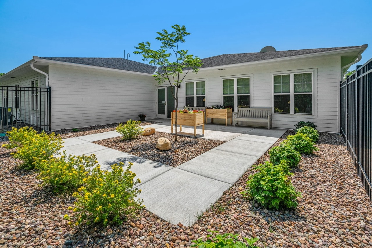Well-maintained outdoor garden space with pathways.
