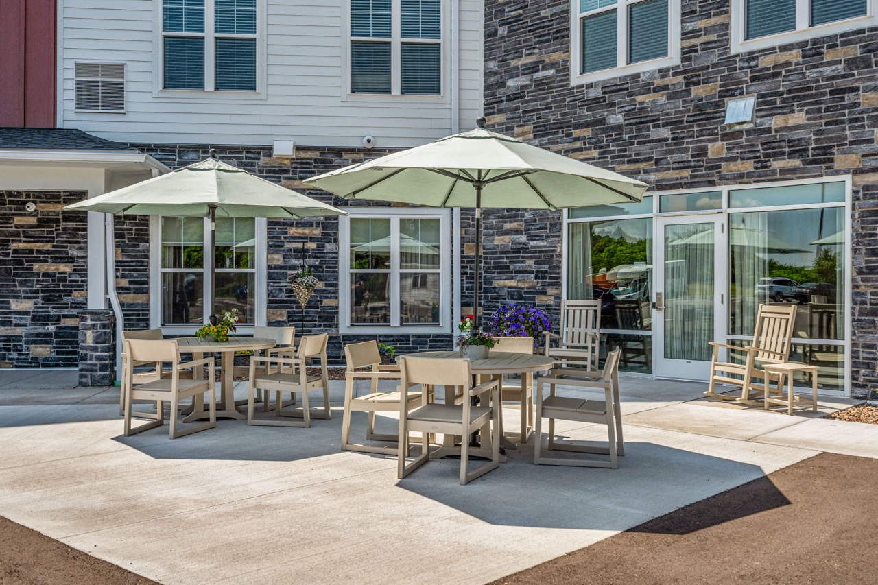 Outdoor seating area with umbrellas and flowers