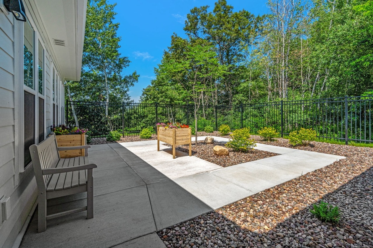 Outdoor garden space with benches and plants