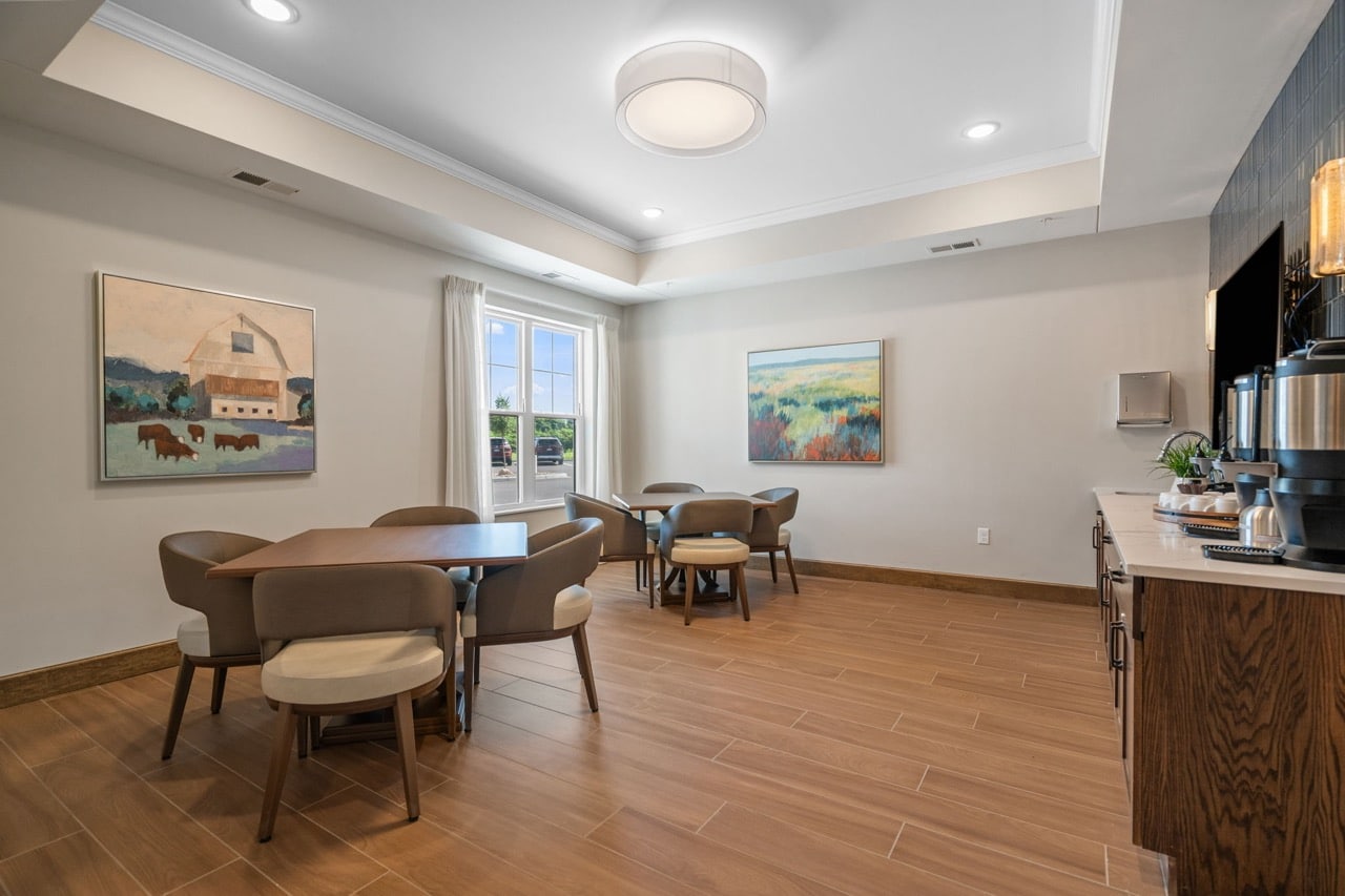Dining area with tables and artwork.