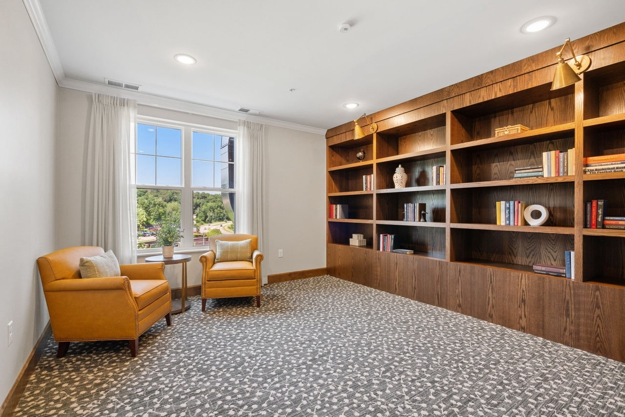 Cozy common area with bookshelves and seating