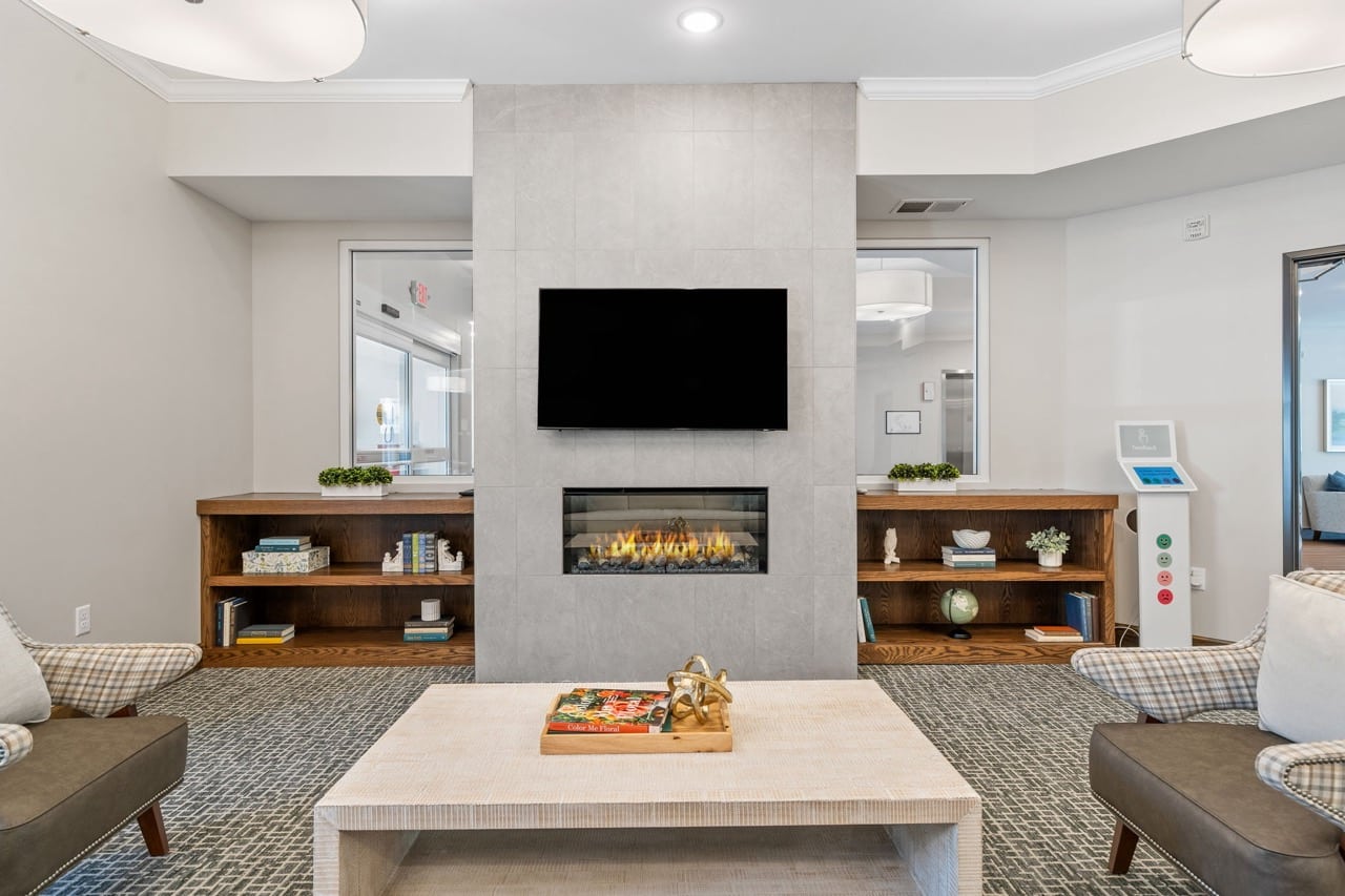 Cozy lounge area with modern decor and fireplace