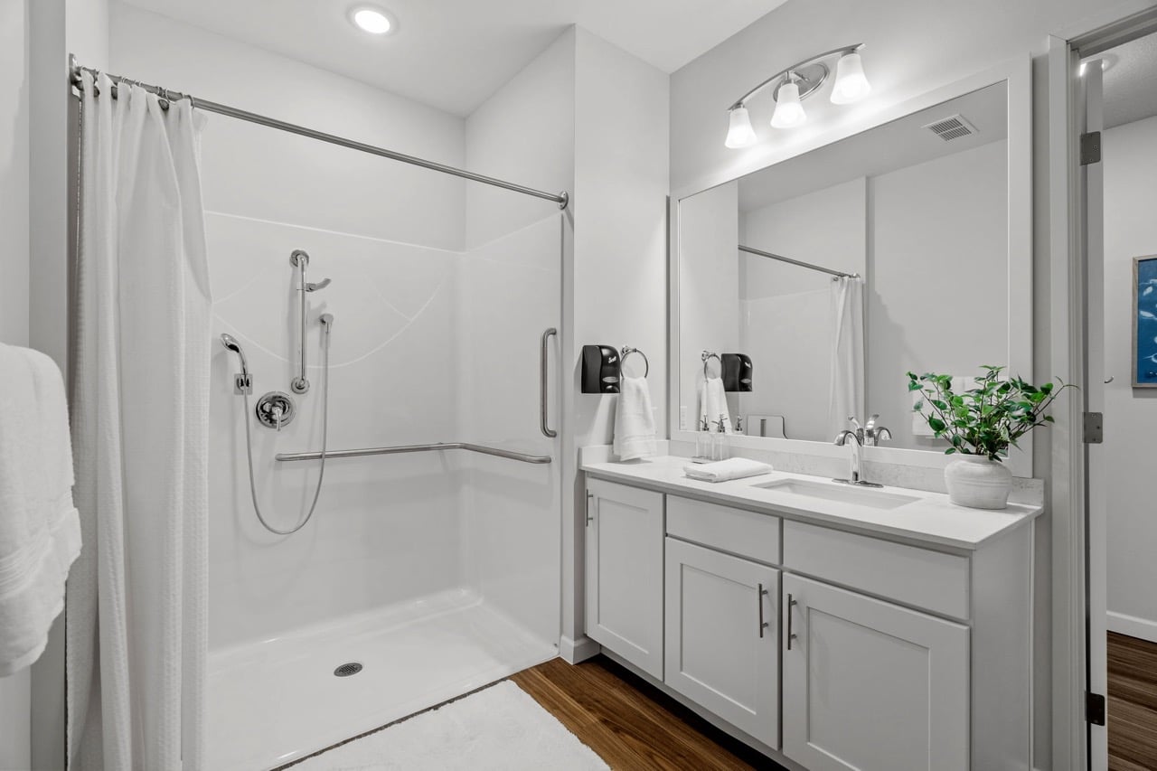 Bathroom with accessible features and modern fixtures.