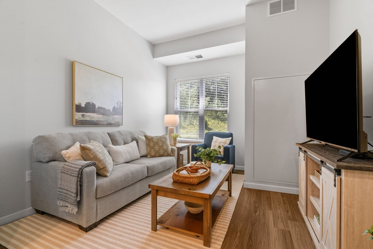 Cozy living area with a sofa and table.