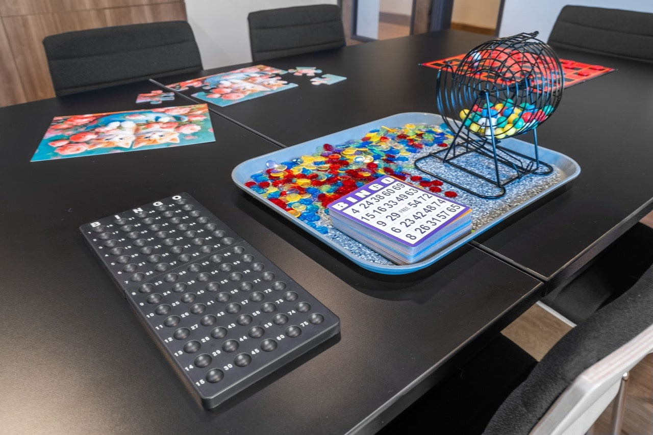 Bingo game setup with colorful chips and cards.