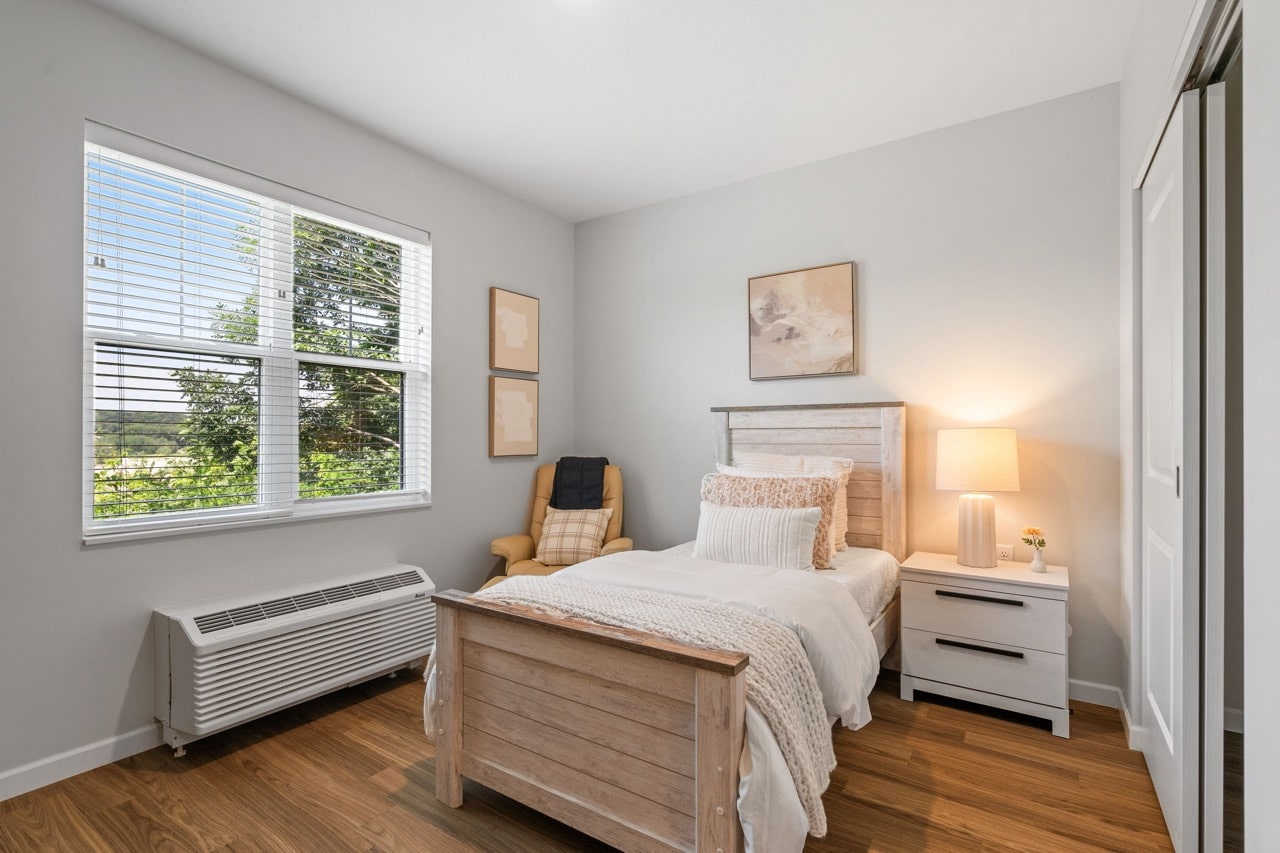 Cozy private bedroom with natural light.