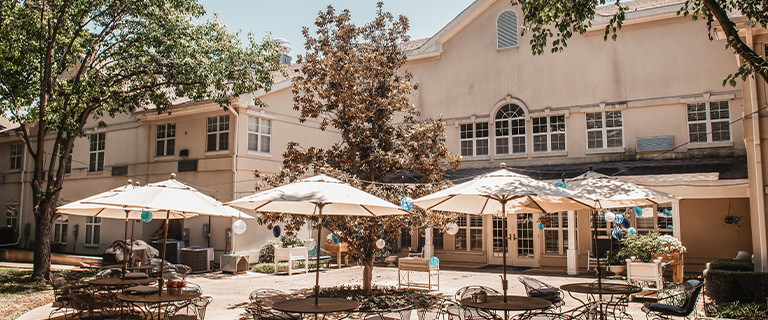 Outdoor patio area with seating and umbrellas