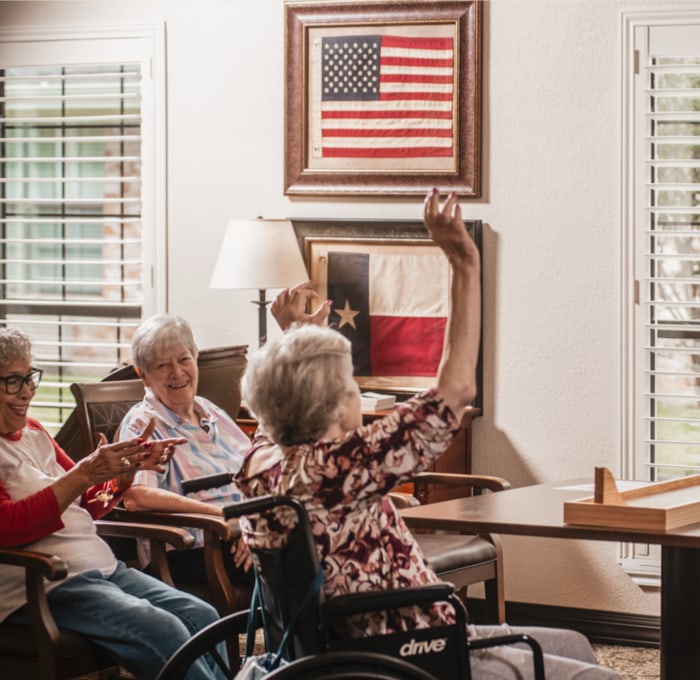 Residents engaging and enjoying an activity indoors.