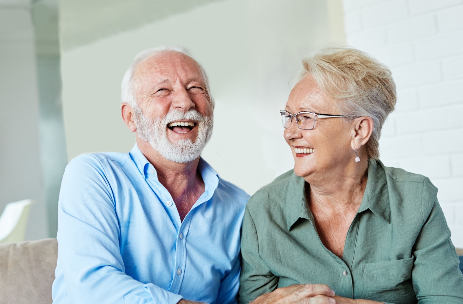 Happy elderly couple laughing together