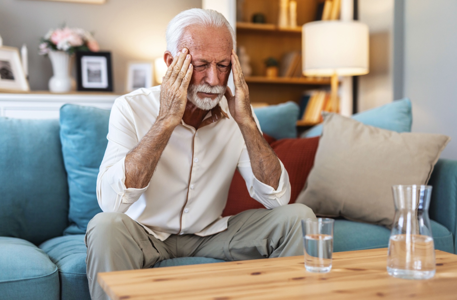 Senior man looking distressed at home.