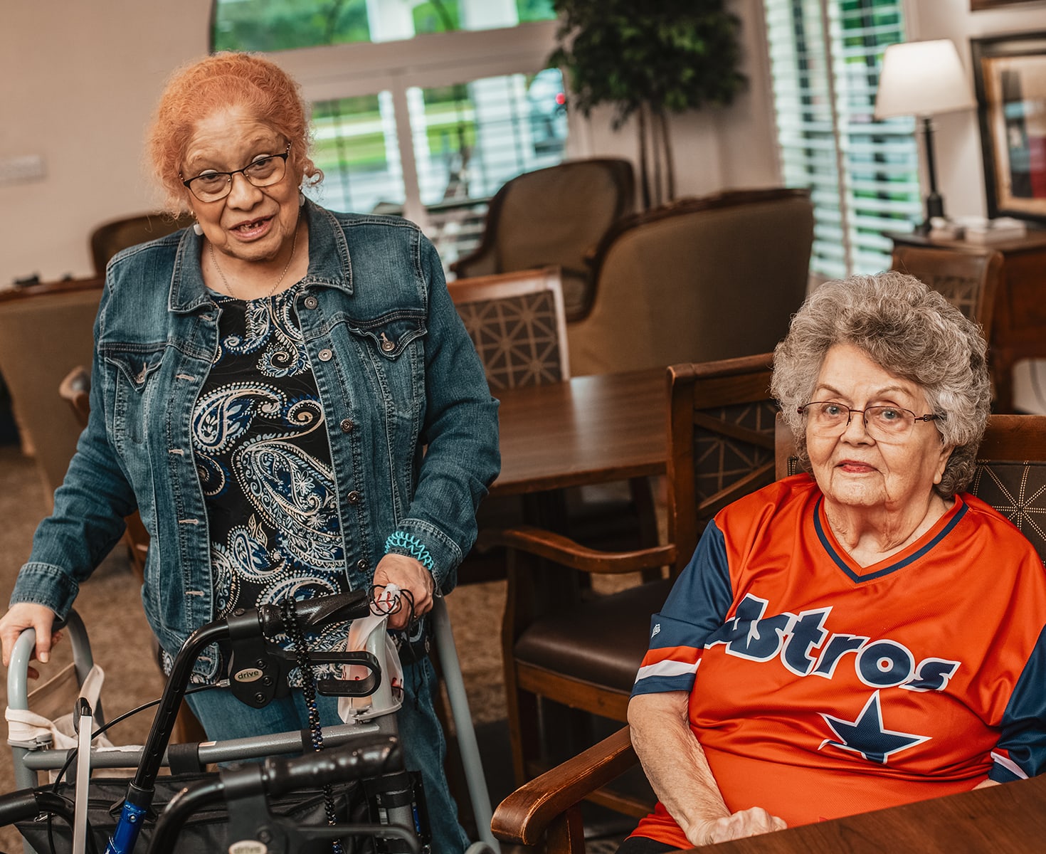 Two residents engaging in a communal space.