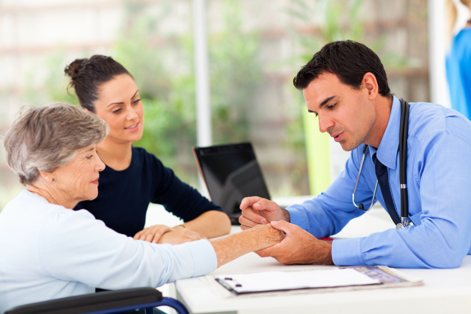 Healthcare professional consulting with elderly resident