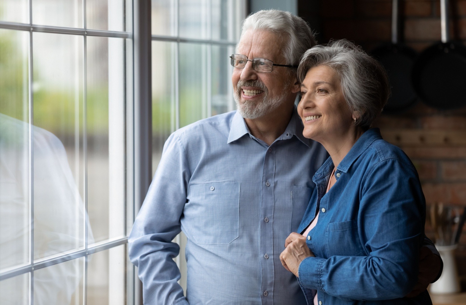 Happy elderly couple enjoying a moment together indoors.