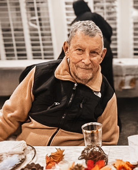 Resident enjoying an indoor gathering with decorations.