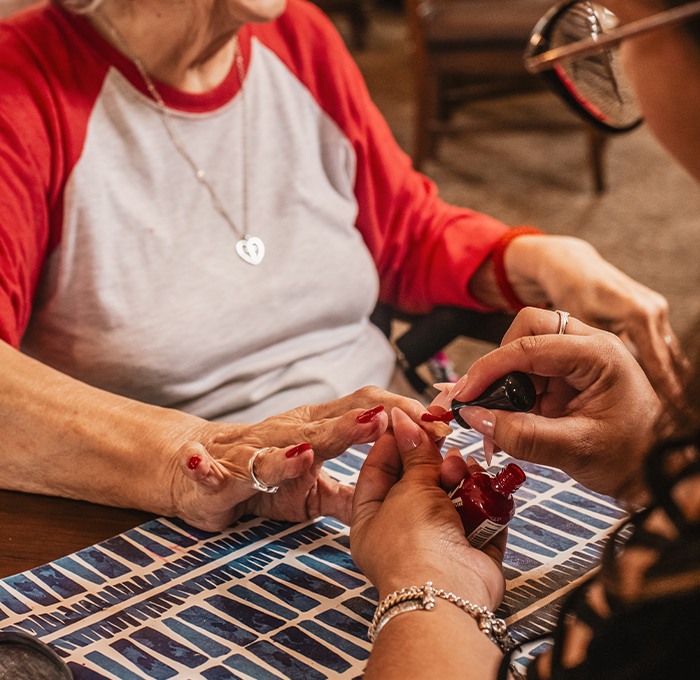 Residents enjoying a manicure activity together.