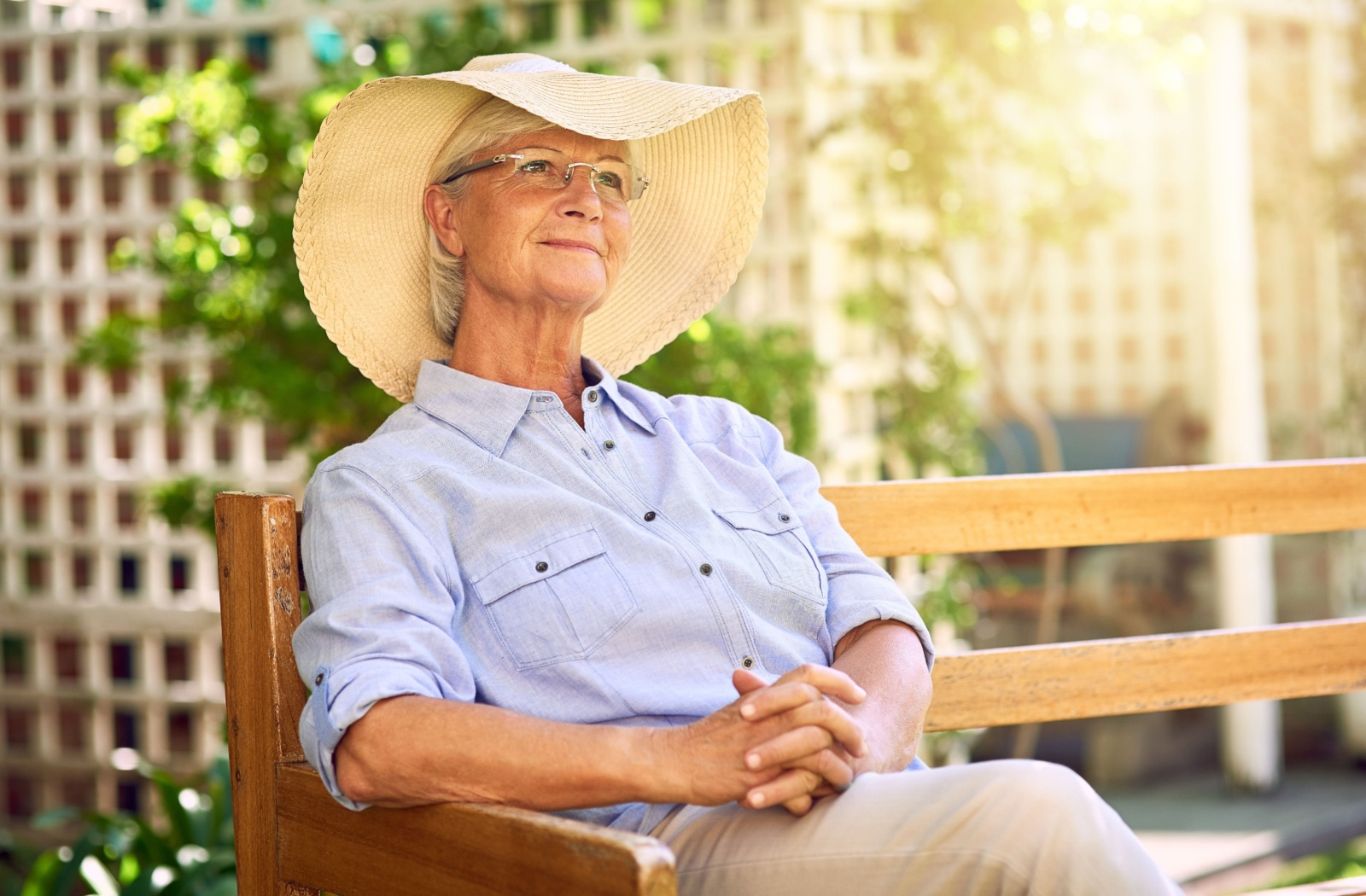 Senior woman enjoying a sunny day outdoors.