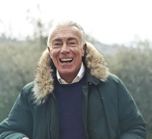 Smiling elderly man outdoors in a warm coat