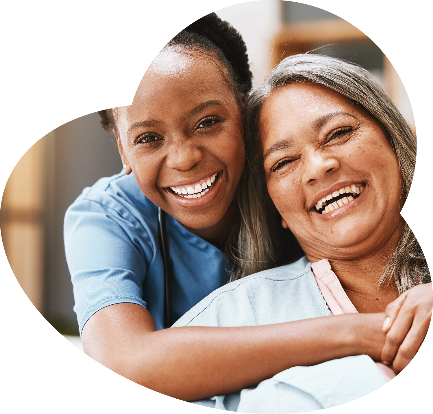 Caregiver and resident smiling together