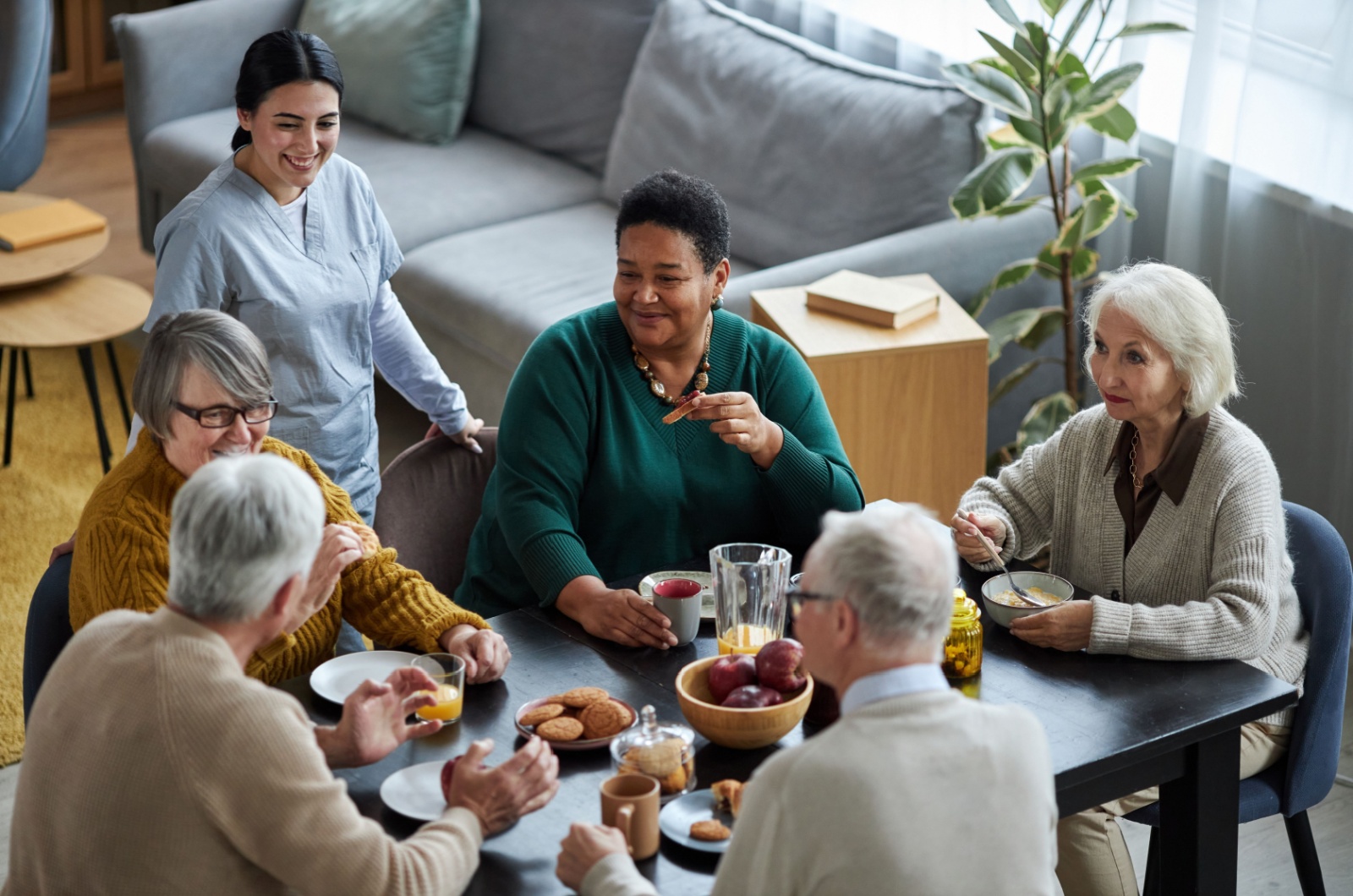 Residents enjoying a meal together in a communal area.