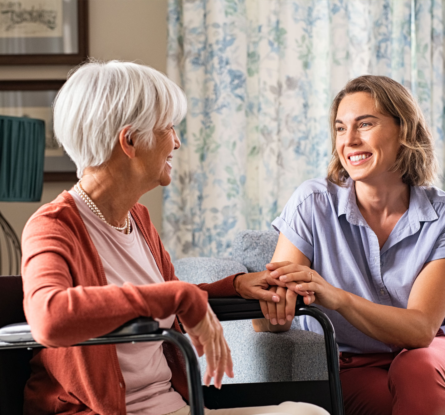Happy interaction between a resident and caregiver