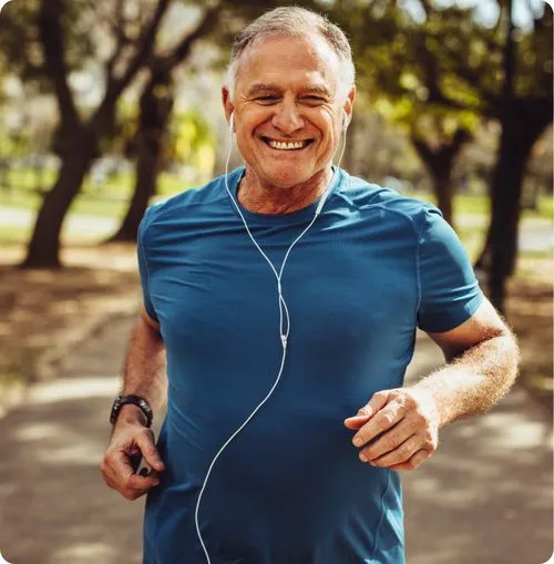 Senior man jogging in a park.